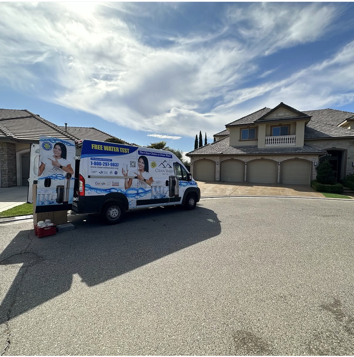 Clean Valley Water branded service van parked at a residential job site